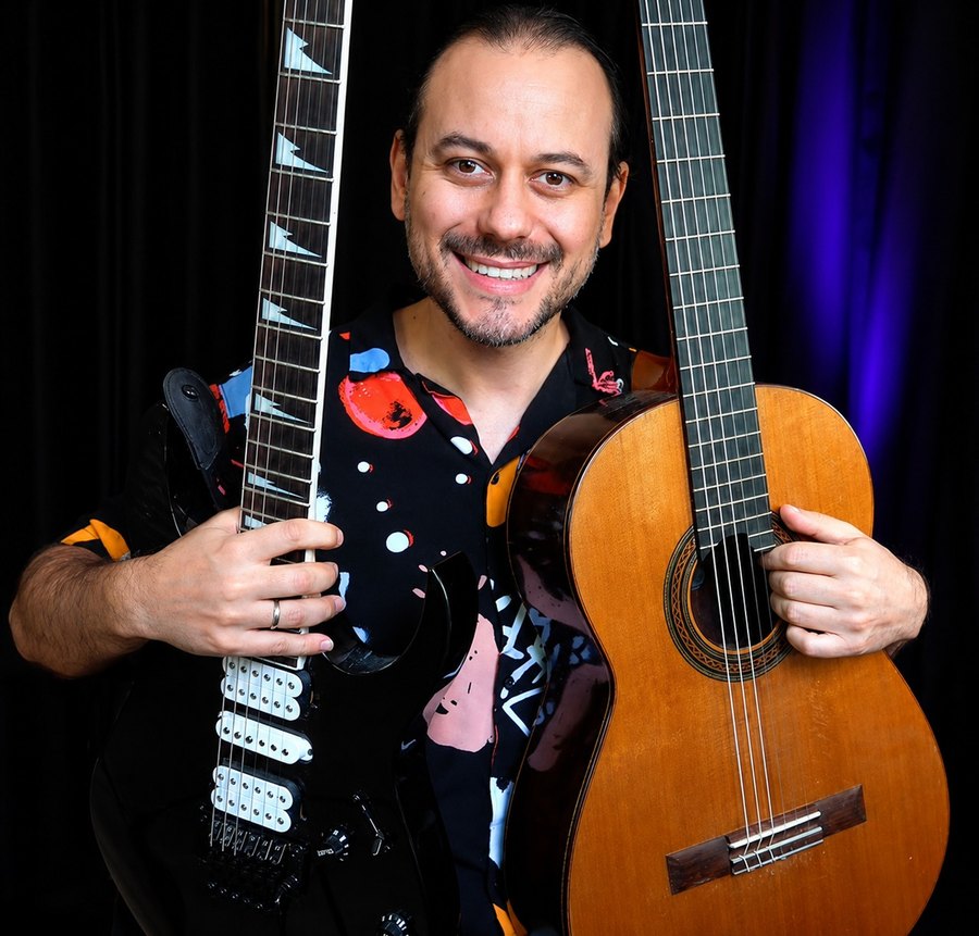 Dr. Eduardo Minozzi Costa with his guitars
