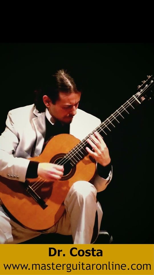 Dr. Costa playing classical guitar at his doctoral recital